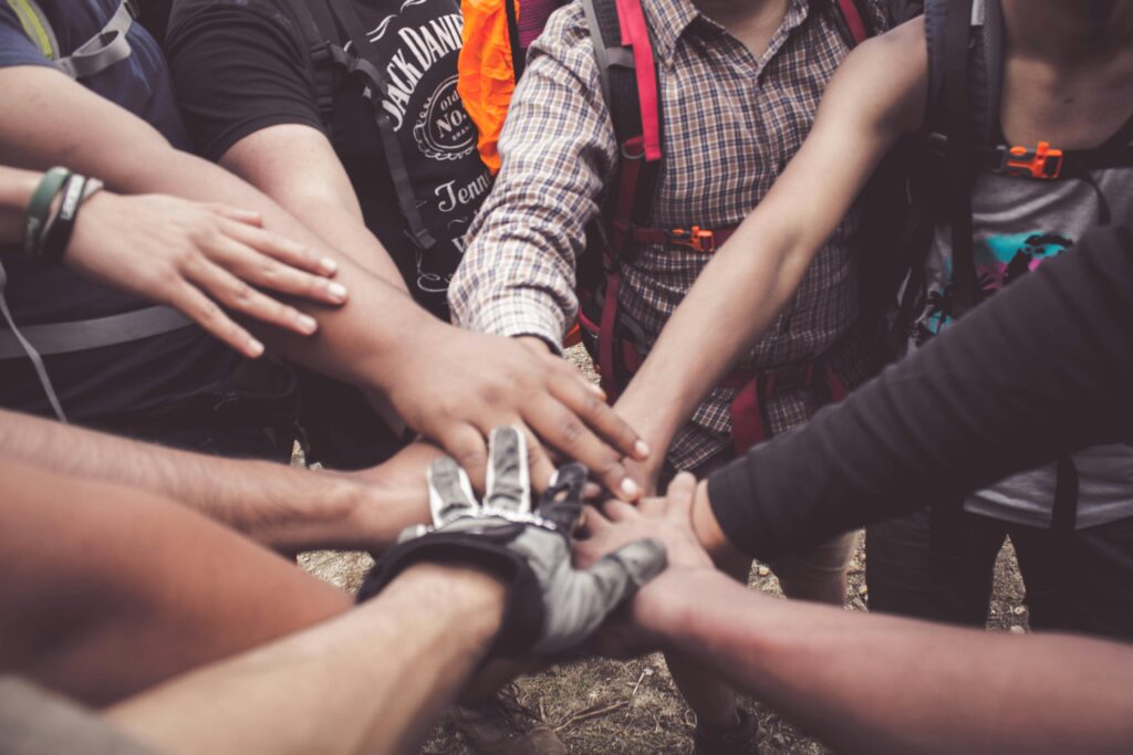 A picture of a group of hands on top of each other